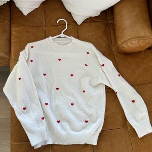 White Sweater with Red Heart Accents